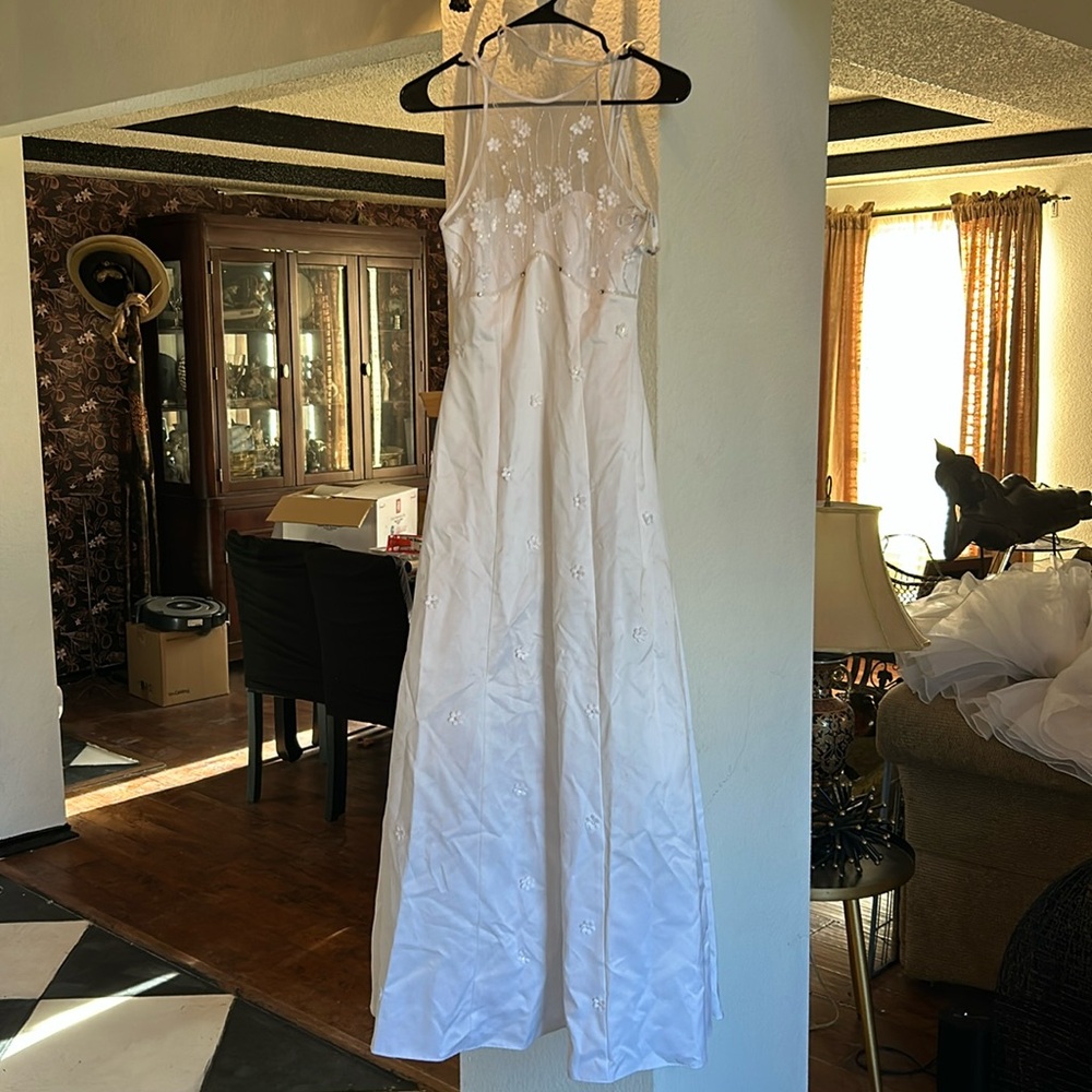 White dress with little flowers . Front is tulle's with a satin strapless top